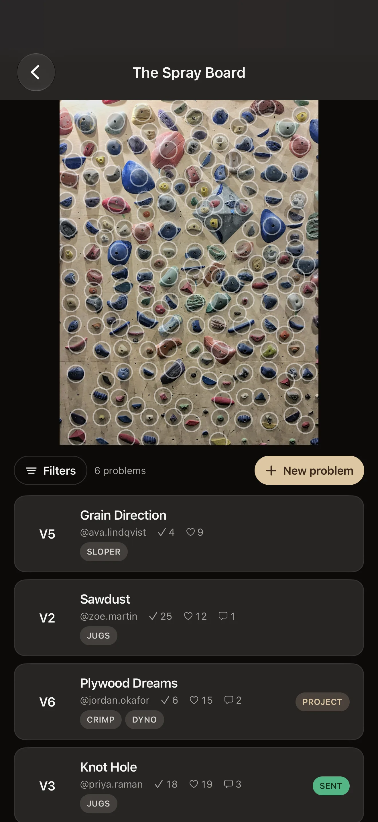 BoulderBase iPhone app showing a spray wall with climber-created problems